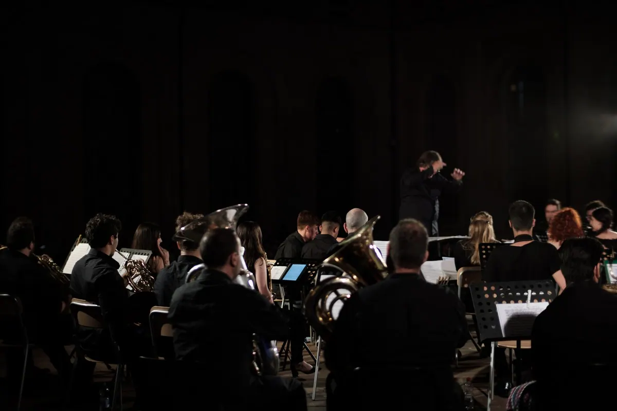 The orchestra on stage in half-light