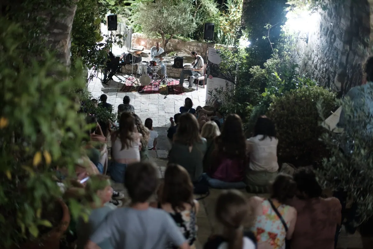 The audience among the trees during the evening programme